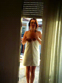 MILF opens towel on a balcony'