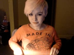 Adorable pale teen with cute smile flashing webcam'