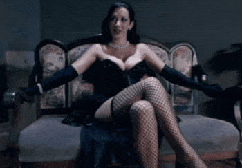 Babes with Big Tits: Brunette Babe Sits on Chair picture 1 of 1