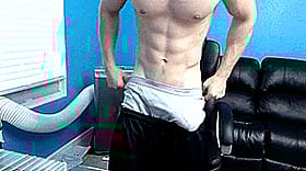 Penis Pulling Out of Black Shorts'
