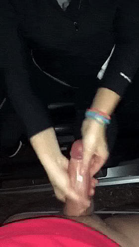 Brunette Amateur Giving a Slick Handjob to a Hard Penis'