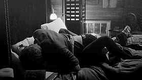 Get Your Freak On: Two People Making Out on a Bed'