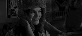 Sexy Chick Smiling at Camera in Knitted Hat'