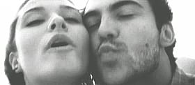 Smoochin' with the chick: A steamy, close-up of two faces'