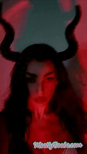 In Ur Face: A Red-Haired Woman with Horns