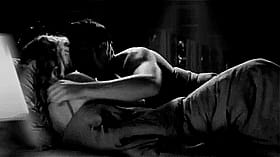 Get Your Freak On: Two People Making Out in Bed'