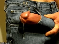 Guy cums through his jeans pocket'